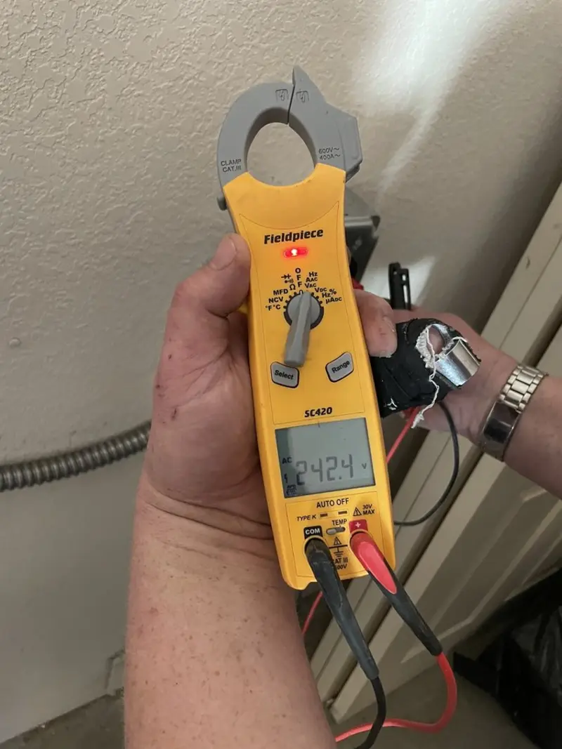 Voltage testing with clamp meter during Circuit Breaker Repair in Carrollton